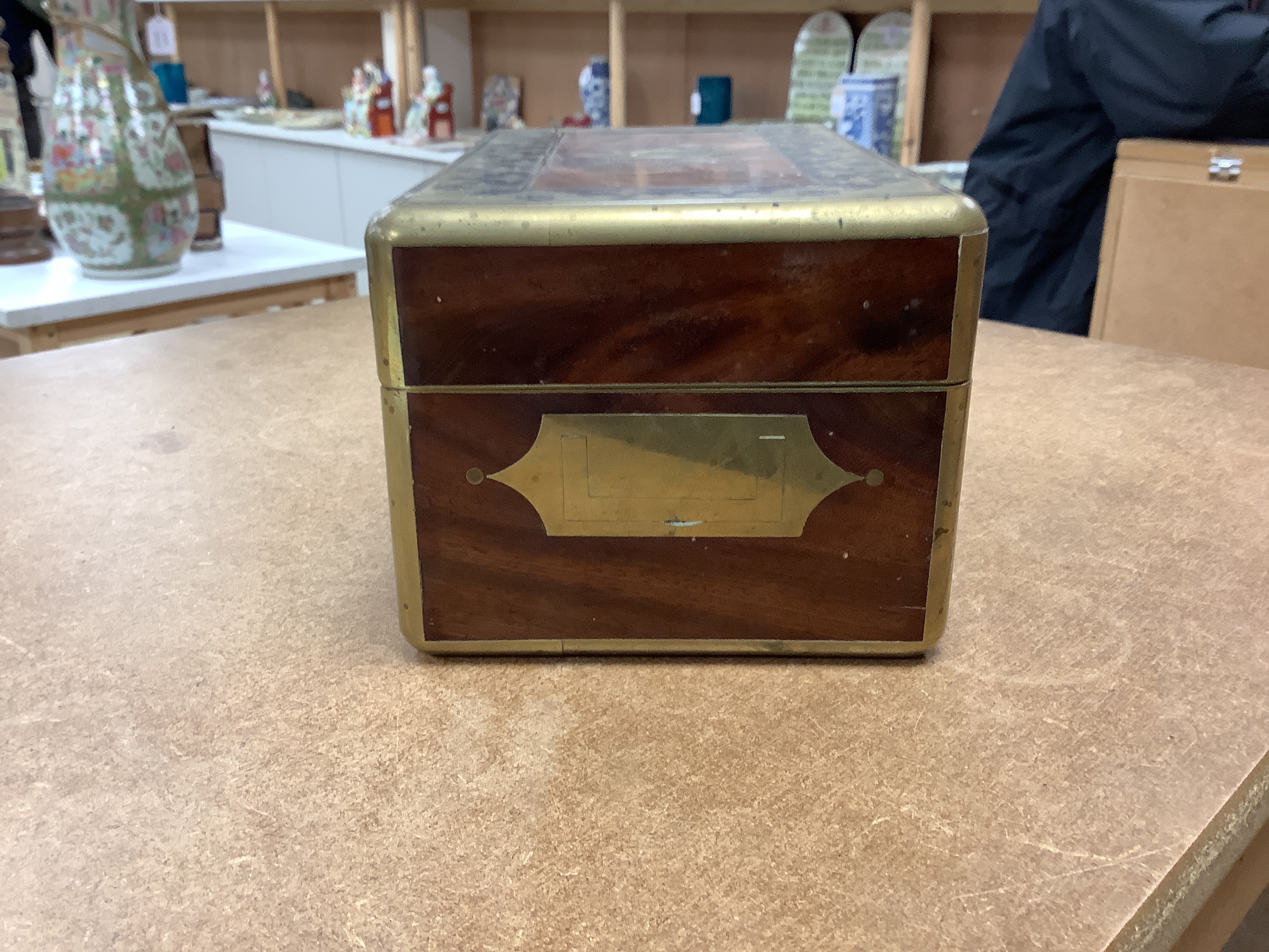 A William IV Cut brass, mahogany and ebony travelling vanity box, with silver-capped bottles, 24.5cm wide